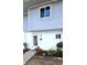 Condo exterior featuring a private entrance and landscaping at 22375 Edgewater Dr # 147, Punta Gorda, FL 33980
