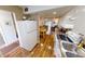 Open kitchen with white cabinets, and view into living area at 22375 Edgewater Dr # 147, Punta Gorda, FL 33980
