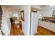 Bright kitchen with white cabinets and wood floors at 22375 Edgewater Dr # 147, Punta Gorda, FL 33980