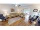 Living room with hardwood floors, comfy seating and access to patio at 22375 Edgewater Dr # 147, Punta Gorda, FL 33980