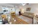 Open living and dining area with wood floors at 22375 Edgewater Dr # 147, Punta Gorda, FL 33980