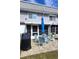 Private patio with seating area, grill, and umbrella at 22375 Edgewater Dr # 147, Punta Gorda, FL 33980