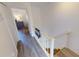 Stairwell leading to upper level, showcasing light wood floors at 22375 Edgewater Dr # 147, Punta Gorda, FL 33980