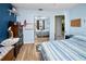 Bedroom with mirrored closet doors and blue walls at 2275 Kenya Ln, Punta Gorda, FL 33983