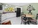 Bright eat-in kitchen with granite countertops and stainless steel appliances at 2275 Kenya Ln, Punta Gorda, FL 33983