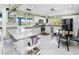 Large kitchen featuring granite island and breakfast nook at 2275 Kenya Ln, Punta Gorda, FL 33983