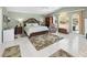Large main bedroom with wood furniture and access to backyard at 2275 Kenya Ln, Punta Gorda, FL 33983