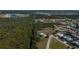 Aerial showcasing a home near a tranquil waterway and lush greenery at 24362 Yacht Club Blvd, Punta Gorda, FL 33955