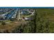 Aerial view of a canal-front lot with neighboring homes visible at 24362 Yacht Club Blvd, Punta Gorda, FL 33955