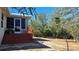 Spacious backyard with wooden deck and lush landscaping at 24362 Yacht Club Blvd, Punta Gorda, FL 33955