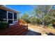 Backyard with wooden deck and screened porch at 24362 Yacht Club Blvd, Punta Gorda, FL 33955