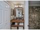 Modern bathroom with a unique wooden vanity and tiled shower at 24362 Yacht Club Blvd, Punta Gorda, FL 33955