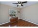 Bedroom with large window and wood flooring at 24362 Yacht Club Blvd, Punta Gorda, FL 33955