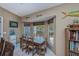 Breakfast nook with rustic wood table and chairs at 24362 Yacht Club Blvd, Punta Gorda, FL 33955