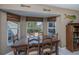 Bright breakfast nook with wood table and view of backyard at 24362 Yacht Club Blvd, Punta Gorda, FL 33955