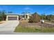 Single story home with attached garage and landscaped yard at 24362 Yacht Club Blvd, Punta Gorda, FL 33955