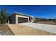 Single-story home with attached garage and gravel driveway at 24362 Yacht Club Blvd, Punta Gorda, FL 33955