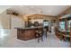 Kitchen with island, stainless steel appliances, and breakfast bar at 24362 Yacht Club Blvd, Punta Gorda, FL 33955
