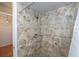 Shower with tile surround and neutral tones at 24362 Yacht Club Blvd, Punta Gorda, FL 33955