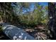 White canoe rests on the edge of a mangrove waterfront at 24362 Yacht Club Blvd, Punta Gorda, FL 33955