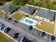 Complex overview showing pool, parking, and building layout at 24540 Harborview Rd # E4, Port Charlotte, FL 33980