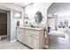 Elegant bathroom with double vanity, granite countertop, and large mirrors at 25188 Marion Ave # 12, Punta Gorda, FL 33950