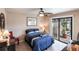 Bedroom with sliding doors to the patio and pool view at 25188 Marion Ave # 12, Punta Gorda, FL 33950