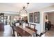 Elegant dining room features a wood table, chandelier, and views to living areas at 25188 Marion Ave # 12, Punta Gorda, FL 33950