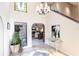 Elegant entryway with high ceilings and stained glass accents at 25188 Marion Ave # 12, Punta Gorda, FL 33950