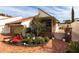 Spanish style home with red tile roof and lush landscaping at 25188 Marion Ave # 12, Punta Gorda, FL 33950