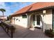 Home's exterior with a wooden deck and decorative entryway at 25188 Marion Ave # 12, Punta Gorda, FL 33950