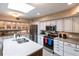 Well-equipped kitchen features stainless steel appliances and an expansive island at 25188 Marion Ave # 12, Punta Gorda, FL 33950