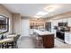 Modern kitchen boasts stainless steel appliances, an island, and ample cabinet space at 25188 Marion Ave # 12, Punta Gorda, FL 33950