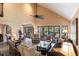 Spacious living room with high ceilings, comfortable seating, and pool access at 25188 Marion Ave # 12, Punta Gorda, FL 33950