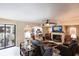 Open living area with fireplace, comfortable seating, and kitchen views at 25188 Marion Ave # 12, Punta Gorda, FL 33950