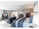 Spacious main bedroom with king bed, sitting area, and built-in window seat at 25188 Marion Ave # 12, Punta Gorda, FL 33950