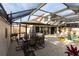 Enjoy alfresco dining in this covered patio overlooking the pool at 25188 Marion Ave # 12, Punta Gorda, FL 33950