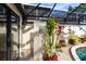 Relaxing poolside patio with tropical plants and a tranquil atmosphere at 25188 Marion Ave # 12, Punta Gorda, FL 33950