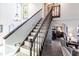 Grand staircase with wood railings and stained glass window at 25188 Marion Ave # 12, Punta Gorda, FL 33950