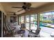 Bright sunroom with comfortable seating and pool views at 25188 Marion Ave # 12, Punta Gorda, FL 33950