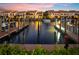 Breathtaking view of the marina and waterfront community at sunset at 25188 Marion Ave # 12, Punta Gorda, FL 33950