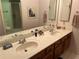 Double vanity bathroom with updated sinks at 25188 Marion Ave # F201, Punta Gorda, FL 33950