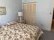 Guest bedroom with double bed and closet at 25188 Marion Ave # F201, Punta Gorda, FL 33950