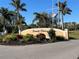 Emerald Pointe community entrance with landscaping and signage at 25188 Marion Ave # F201, Punta Gorda, FL 33950