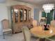 Spacious dining area featuring a hutch and an oval dining table with chairs at 25188 Marion Ave # F201, Punta Gorda, FL 33950