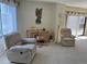 Living room features comfortable seating and a work area at 25188 Marion Ave # F201, Punta Gorda, FL 33950