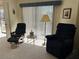 Bright living room with ample natural light and comfortable seating at 25188 Marion Ave # F201, Punta Gorda, FL 33950