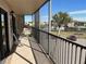 Enjoy water views from this spacious screened balcony with seating at 25188 Marion Ave # F201, Punta Gorda, FL 33950