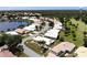 An aerial view showcases the community's homes, set amongst lush greenery and serene water features at 26166 Stillwater Cir, Punta Gorda, FL 33955