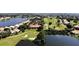 Breathtaking aerial view of a golf course community with stunning water features and lush landscaping at 26166 Stillwater Cir, Punta Gorda, FL 33955